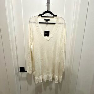 NWT. Womens white pull-on sweater with ruffle